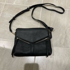 Black Free People crossbody purse in black with gold accents